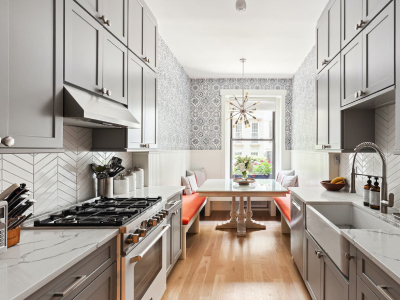 Modern kitchen renovation with island and stainless steel appliances